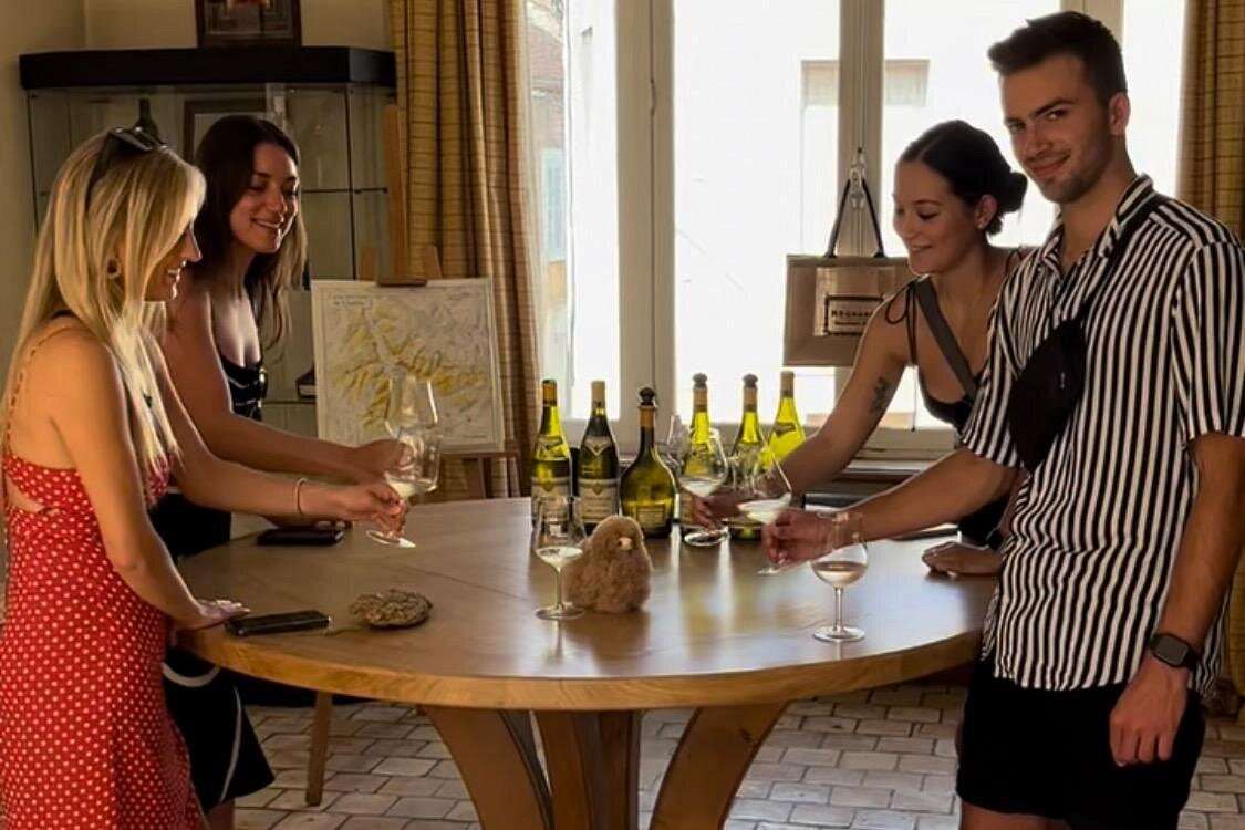 Customers tastig some Chablis white wines in Burgundy wine & cheese tasting trip